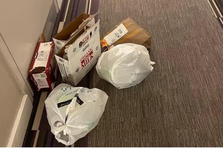 Unbroken cardboard boxes in the hallway at unit 1-5308