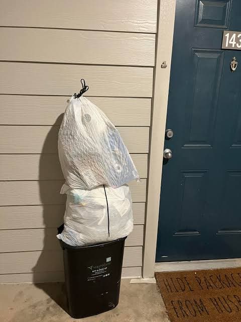 Overflowing bin at unit 2-2104